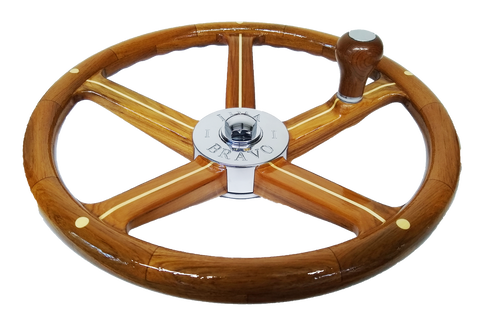 wooden powerboat steering wheel with knob and fingergrips built be south shore boatworks varnished with holly inlay on teak and chromed bronze hub